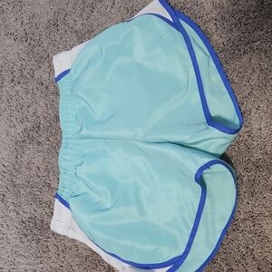 Never worn danskin shorts teal size 8-10